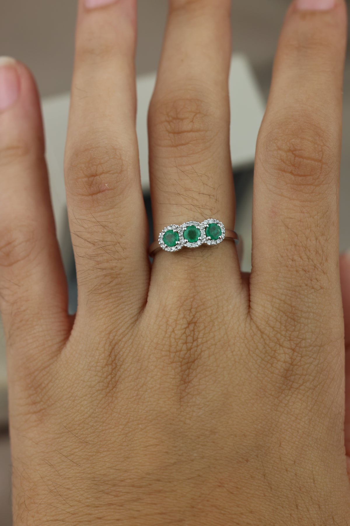 Round-cut emerald ring