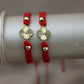 Pulsera tejida con dije de flor #505