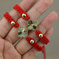 Pulsera tejida con dije de flor #505
