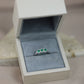 Round-cut emerald ring