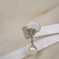 Aretes largos de 18K en oro blanco con perlas y diamantes#05